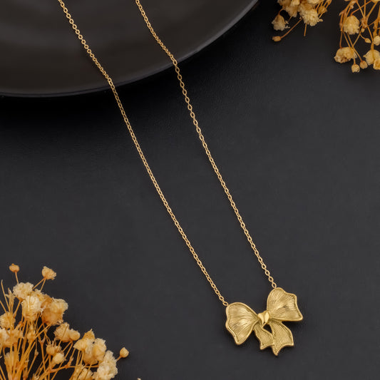 🎀 Twinkle Tie – Gold Bow Pendant Necklace